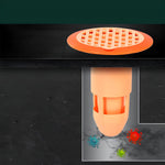 Transparent plastic drain strainer fitted in modern bathroom floor drain