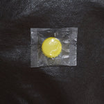 Reusable silicone bottle cap cover in use