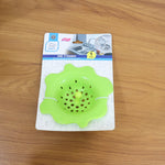 Durable silicone strainer shown with center pull knob for hygienic removal.