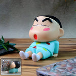 Front view of cute cartoon figurine mobile phone stand for smartphones