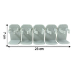Wall mounted kitchen rack holding assorted spice jars