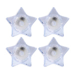 Flameless LED candles shaped like stars providing ambient light