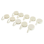 Adhesive round wall hooks organizing kitchen tools effectively