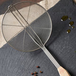 Oil draining skimmer spoon for safe frying and cooking