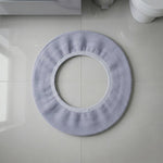 Stretchable toilet seat cover shown separately for demonstration