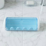 Front view of wall mounted protective toothbrush holder
