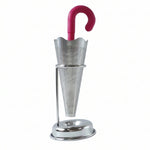 Stainless steel umbrella tea infuser resting securely on its dedicated drip tray stand, preventing spills.