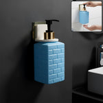 Sleek white wall-mounted liquid soap dispenser on kitchen wall