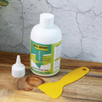 Hand applying waterproof wall filler cream to damaged wall surface