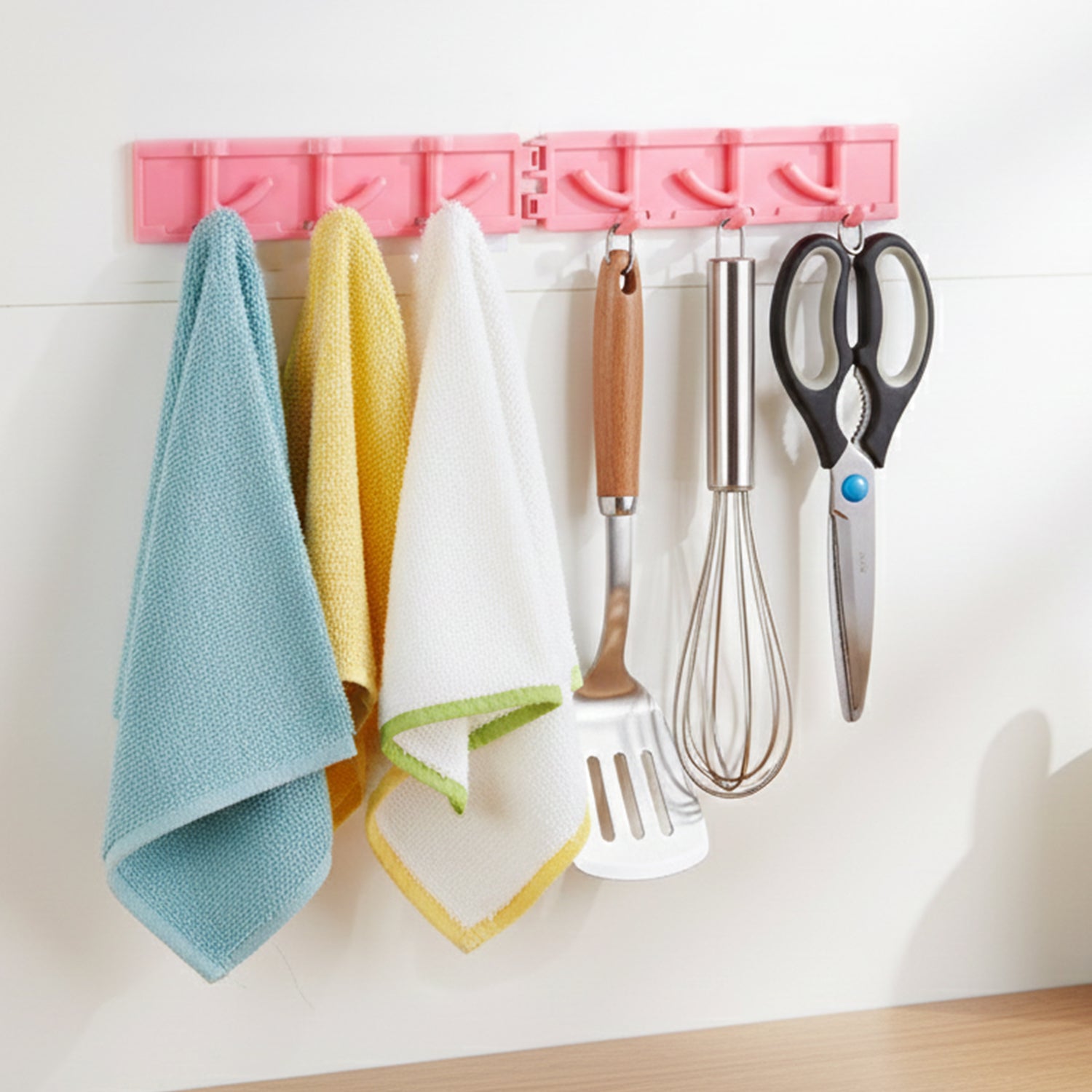 Foldable wall hook rack showing adhesive installation on smooth surface