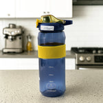 Close-up front of sports water bottle with measurement scale visible