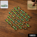 Set of assorted glass marbles for kids featuring traditional kancha game colors and designs