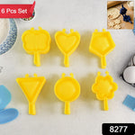 Close-up of plastic cookie cutters shaped like stars and flowers for baking