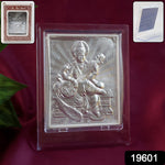 Close-up of embossed Goddess Saraswati detail on silver photo frame