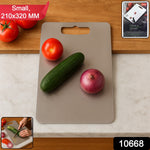 Close-up view of stainless steel cutting board with handle for daily kitchen use