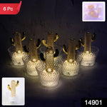 Close-up of cactus LED decorative candle showing golden cactus inside transparent holder