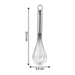 Compact stainless steel whisk stored with hanging loop in kitchen