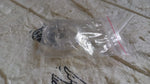 Silicone magnetic nose clip resting on surface before use