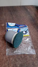 Kitchen scrubber removing burnt grease and food stains effectively