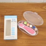 Mother carefully trimming her baby's nails with the gentle electric nail file.