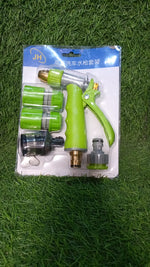User demonstrating the adjustable settings of the water spray nozzle for car washing.