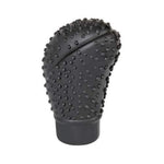 Side view of the flexible gear shift knob cover in black.