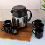 Thermos flask with handle alongside six ceramic cups for hot beverage servings