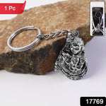 Close-up of Bal Krishna idol on silver finish metal keychain showing intricate craftsmanship