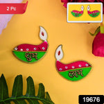 Decorative Shubh Labh diyas hanging on wall, ideal for traditional home décor