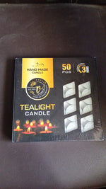 Overhead view of multiple tealight candles in a box.
