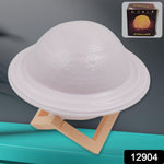 Multicolor 3D Saturn night light displayed on its elegant wooden base.