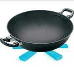 Portable foldable hotmat protecting a dining table from a serving dish.