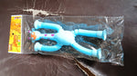 Close-up of the LED giraffe fidget toy's flexible body and suction cup feet.