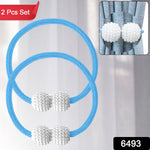 Close-up of magnetic curtain tieback on a sheer curtain showing braided polyester band