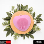 Heart-shaped silicone face wash brush for deep skin cleansing.