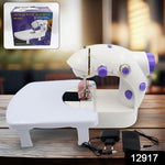 Woman using the portable electric silai machine for home tailoring on a desktop.