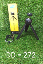 A mini tripod in use, capturing a steady shot with a digital camera.