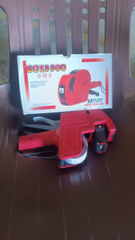 The 8-digit Price Tag Gun in its packaging, ready for use in a retail or market setting.