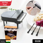 Colorful fruits arranged with the unique piano-shaped dessert picks for a vibrant presentation.