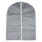 Hanging garment covers protecting clothes inside a closet