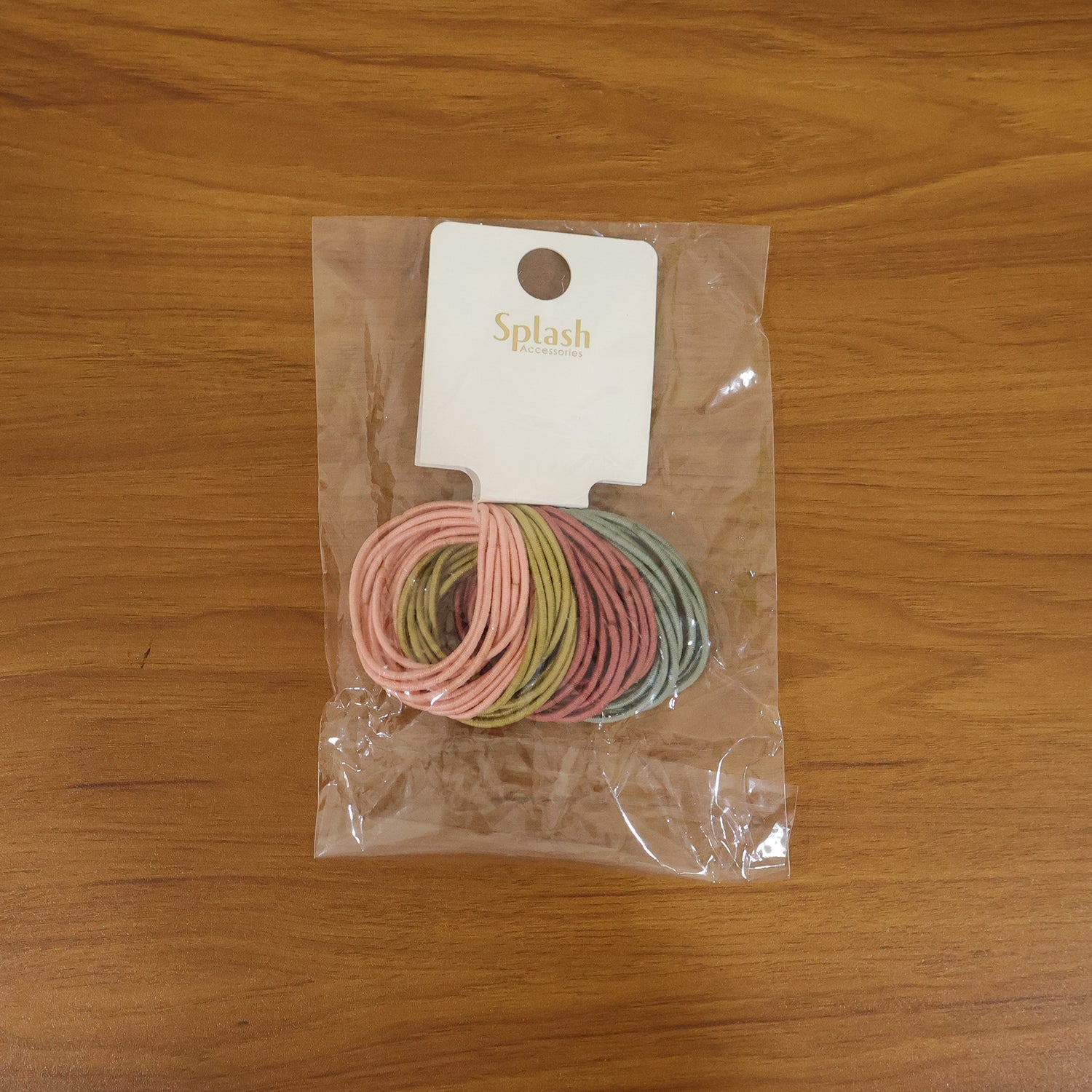 Lifestyle shot of elastic hair bands in use, soft and secure hold