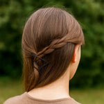 Close-up of big black hair bobby pins displaying smooth rounded tips