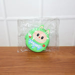 Cartoon coin pouch placed in a lifestyle setting showing portability