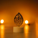 Golden leaf shaped flameless candles arranged for home decoration