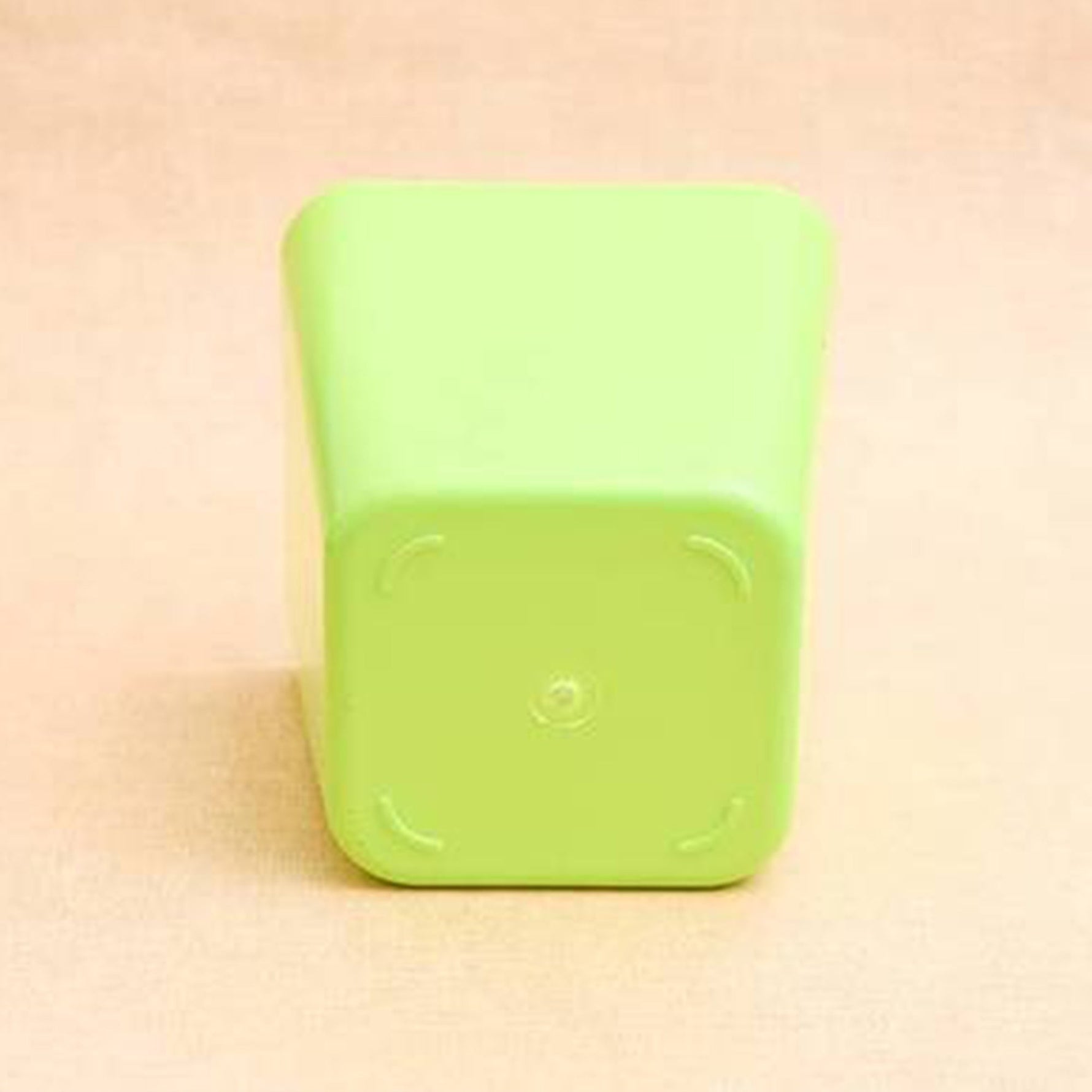 Modern square plastic planter ideal for various indoor plant setups.