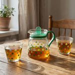 Two glass tea cups from the elegant polka dot tea pot set