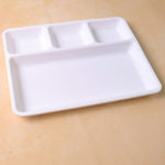 Empty 4-section plastic tray ready for meal preparation or serving.