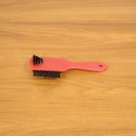 Shoe cleaning brush in use cleaning sneakers to remove dirt and stains