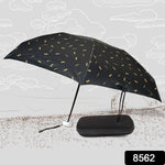 Comparison shot of the folded compact umbrella with a small water bottle, emphasizing its travel-friendly size.