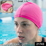 Pink silicone swim cap in vibrant pink color